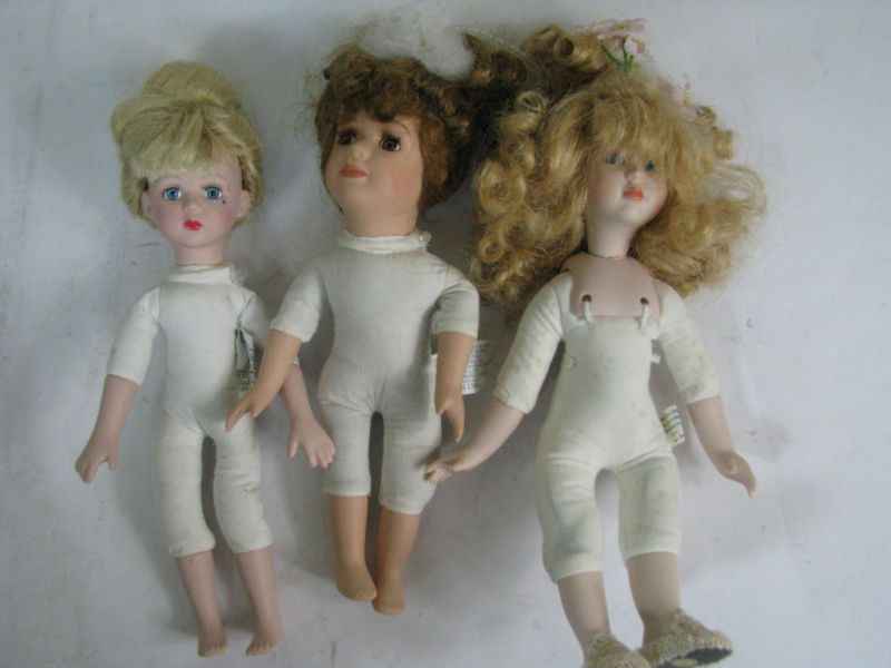 Set of Three Porcelain Baby dolls Brass Key and Tuss  